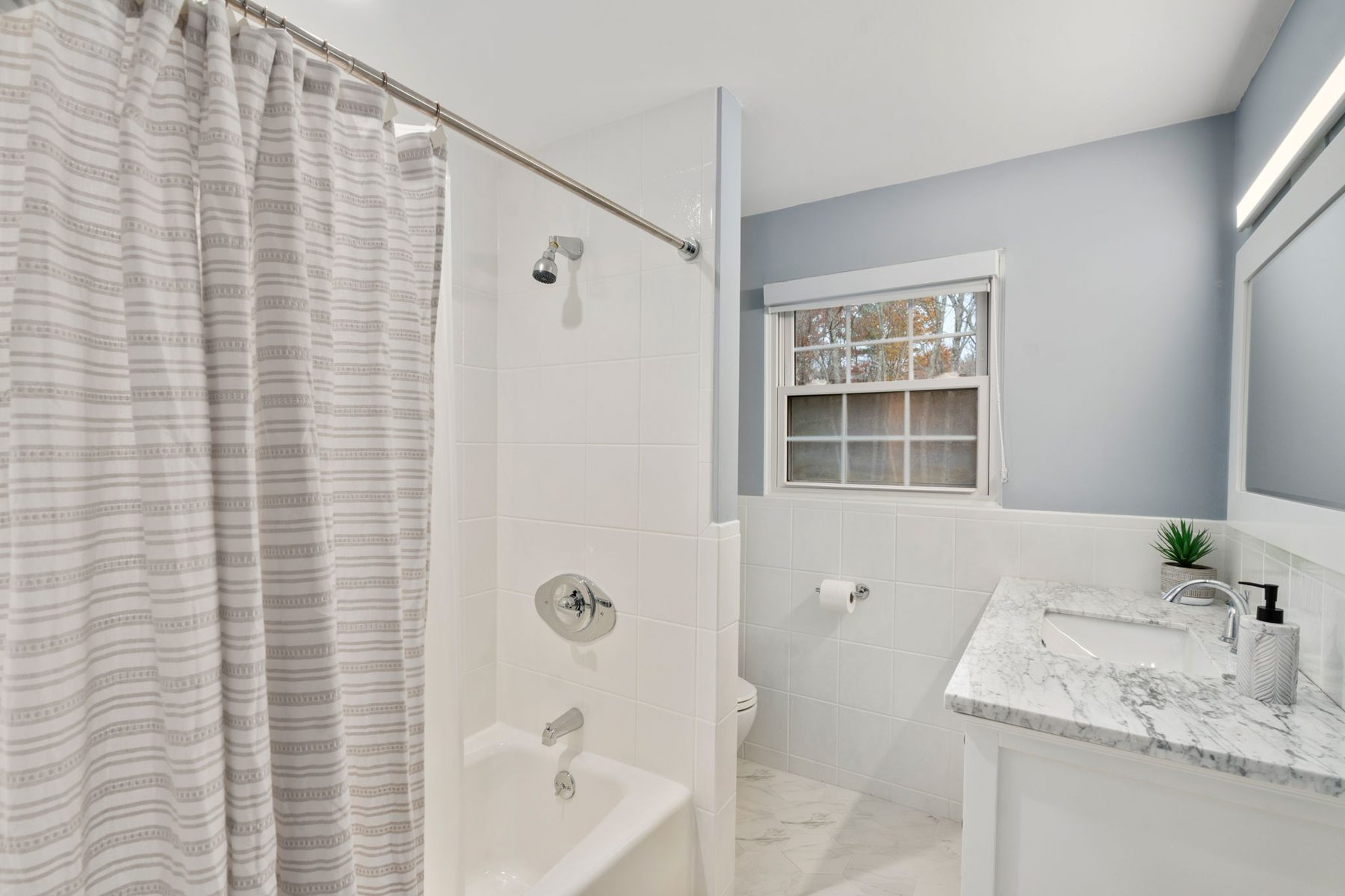 Condor hall bath — hex marble floor, new vanity — after