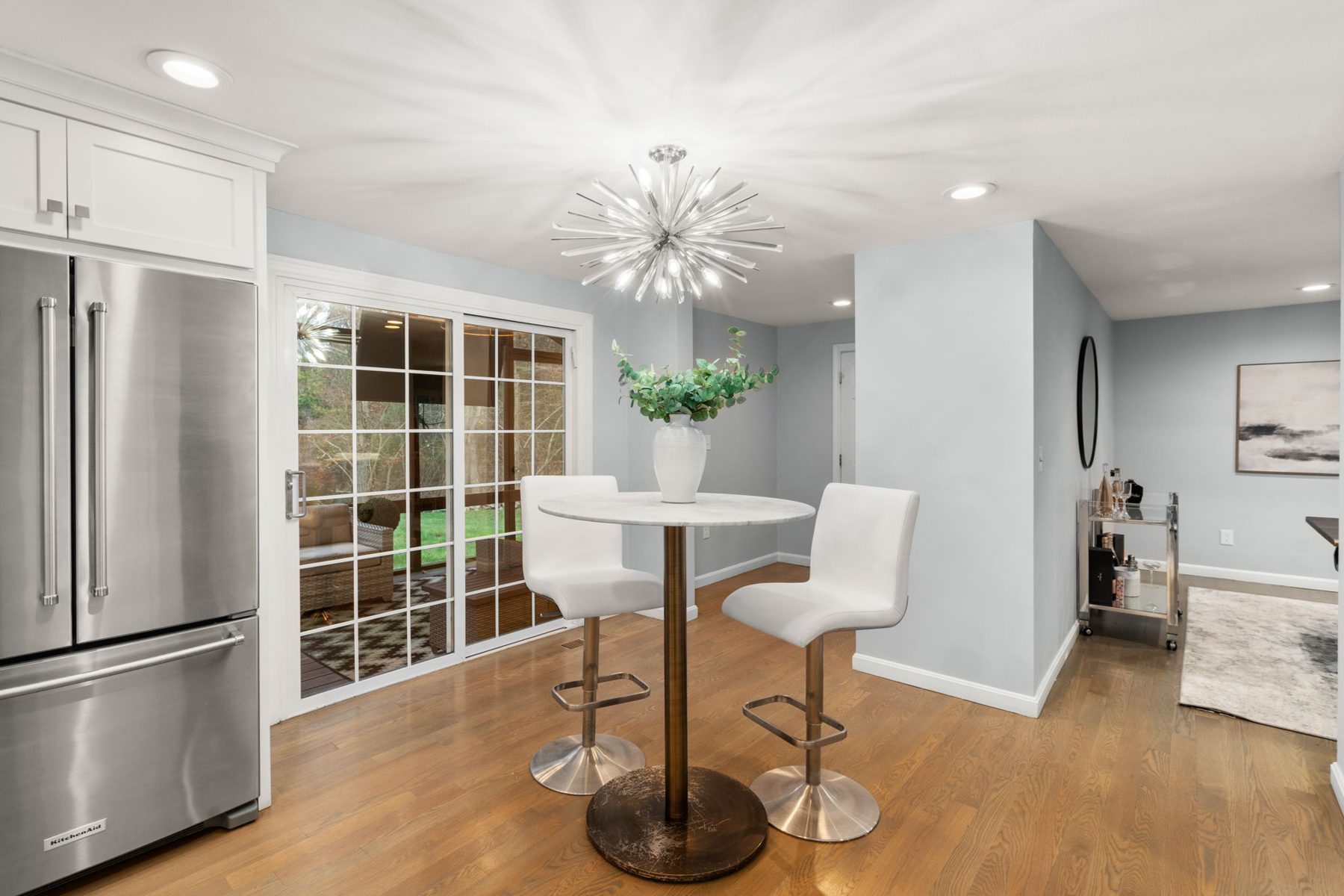 Condor nook — breakfast table to the screened porch — after