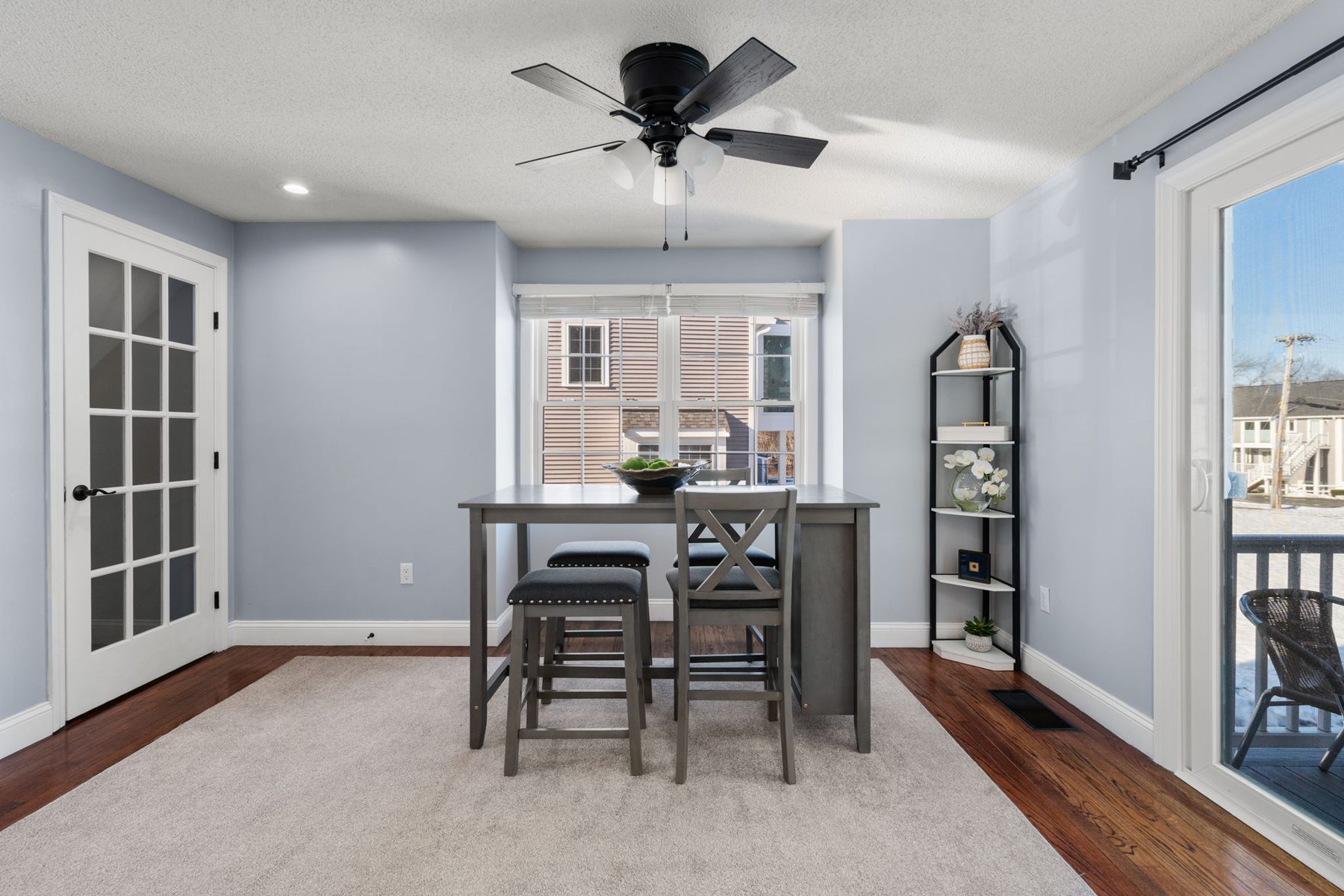 Meadowhill dining — counter-height table, room to walk to the deck door — after