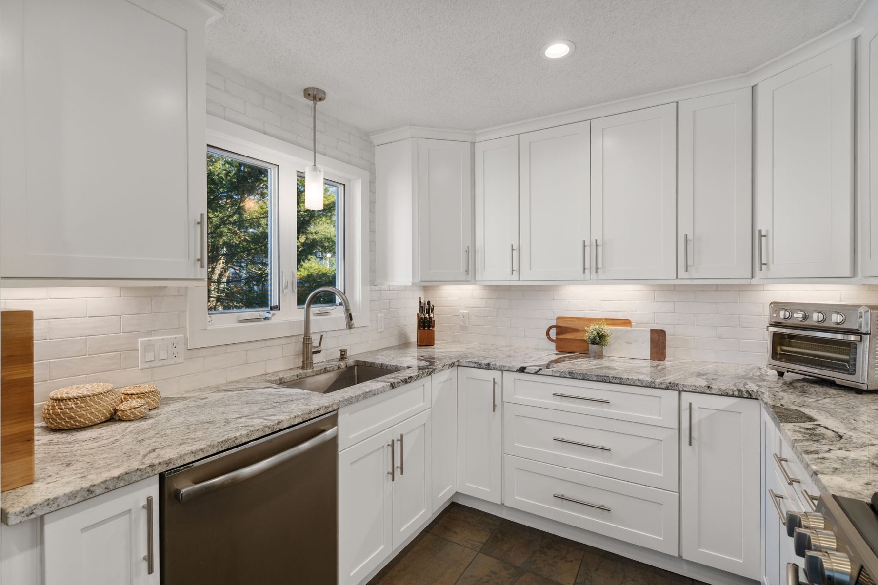 Meadowhill kitchen — granite, white shaker, styled and out of the way — after