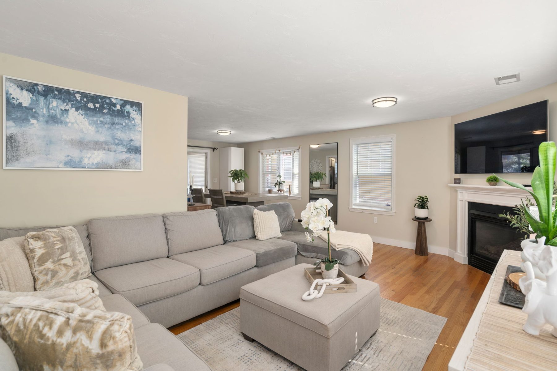 Norwell fireplace — the mantel as the room's only argument — after