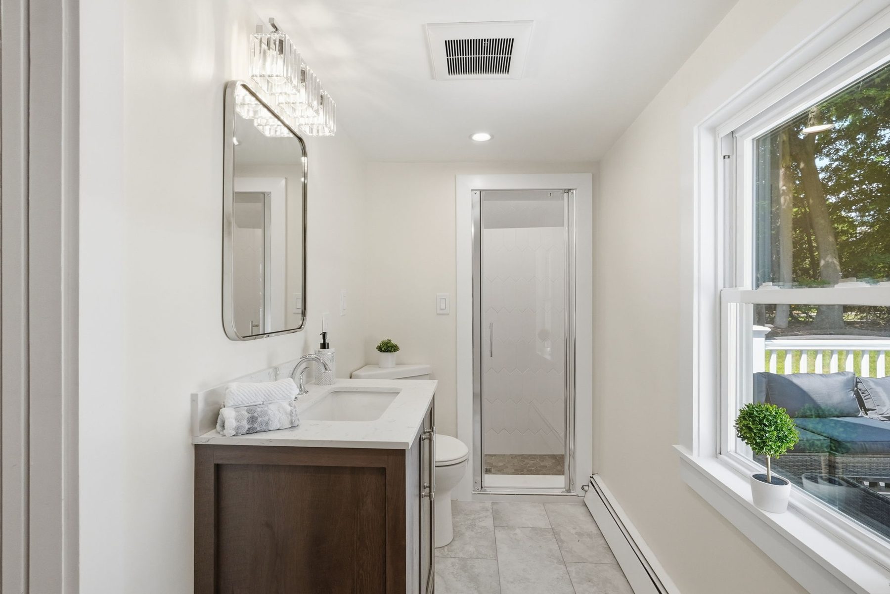 Pemberton bath brown — walnut vanity, glass shower — after
