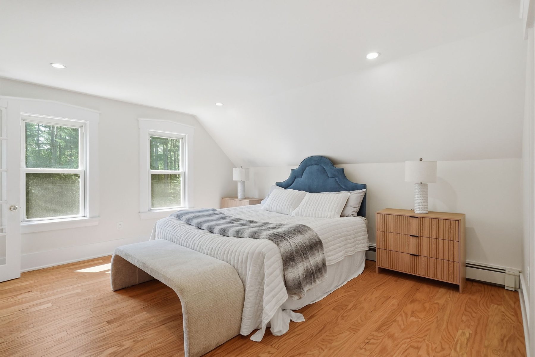Pemberton bedroom blue — blue velvet headboard under the eaves — after