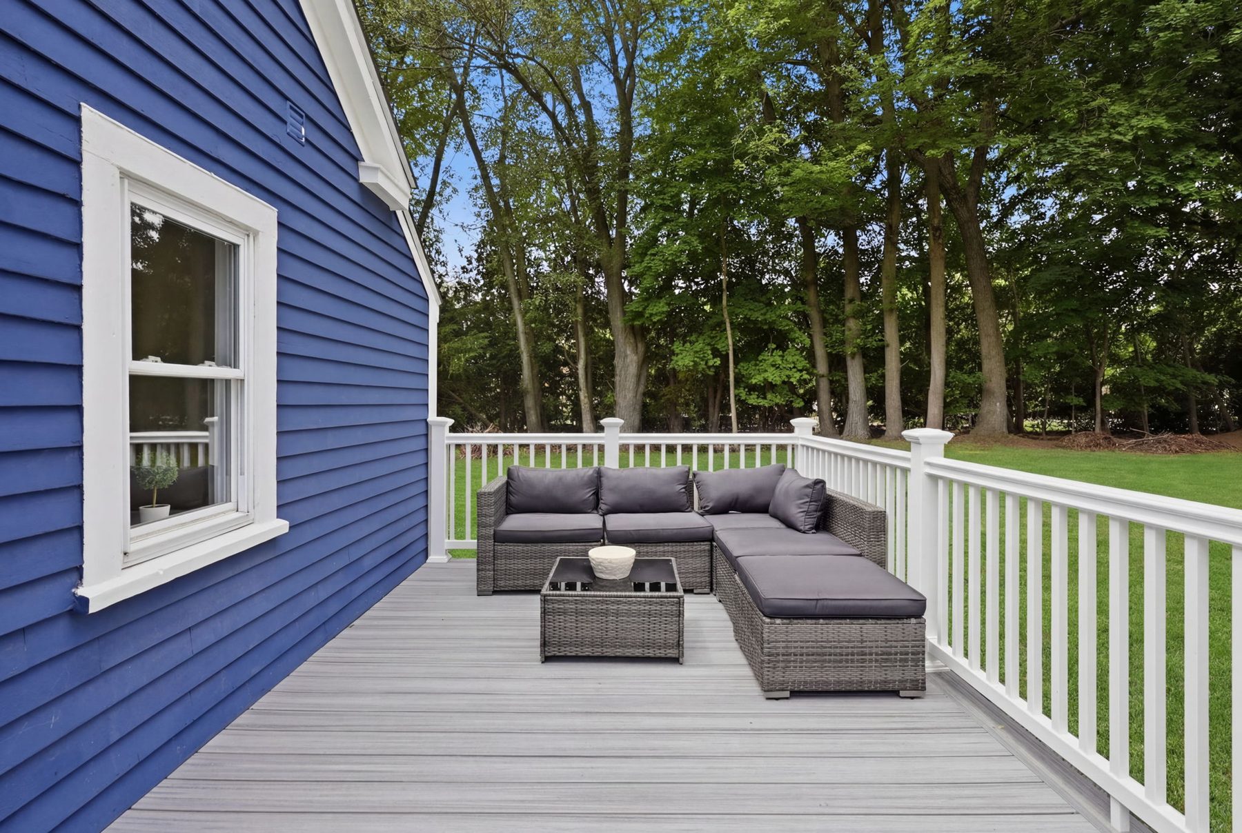 Pemberton deck — composite deck, wicker sectional — after