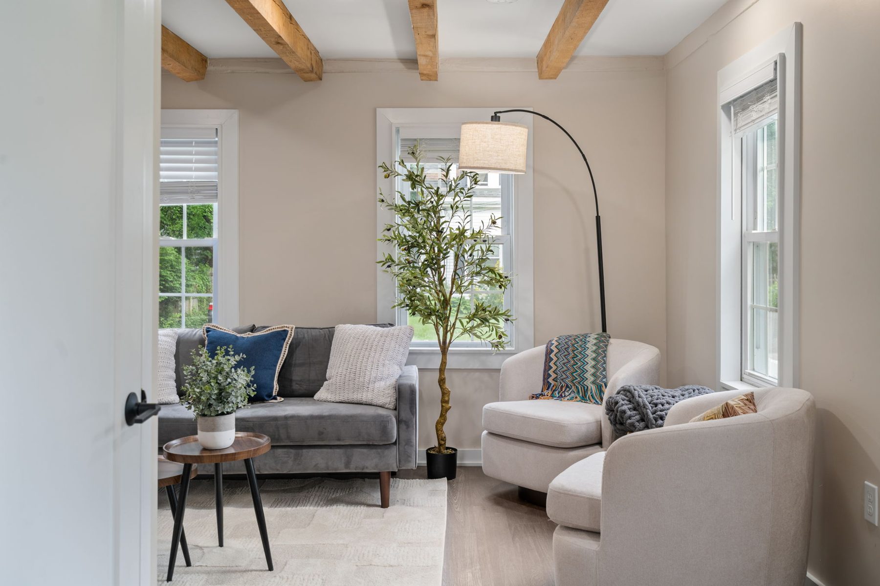 Summit sitting room — two swivel chairs and a view of the yard — after